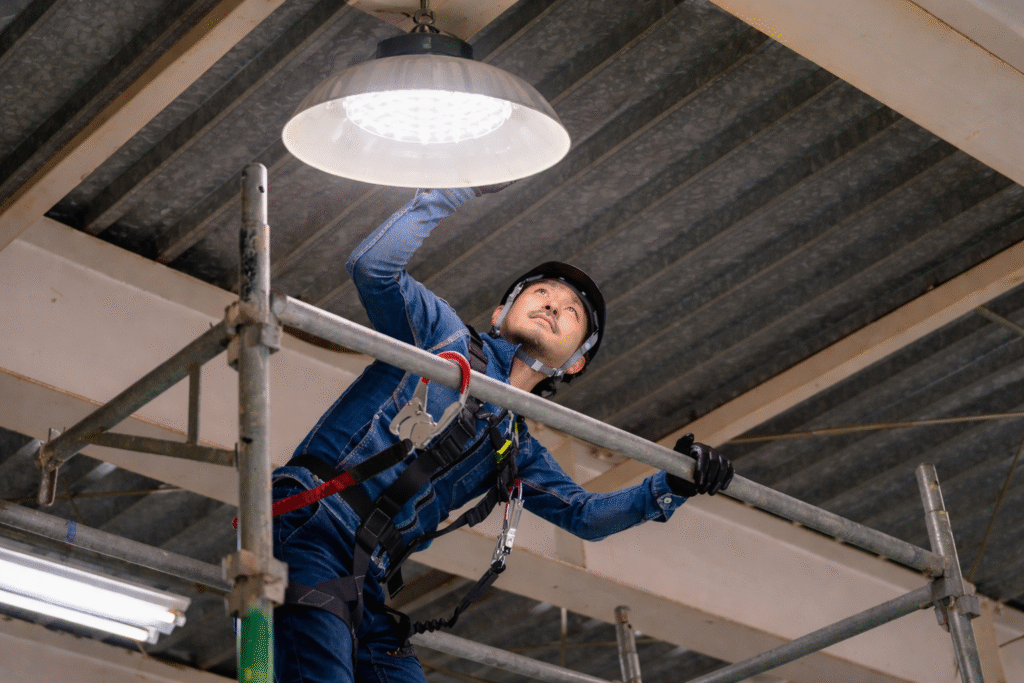 maintenance work on livestock lighting